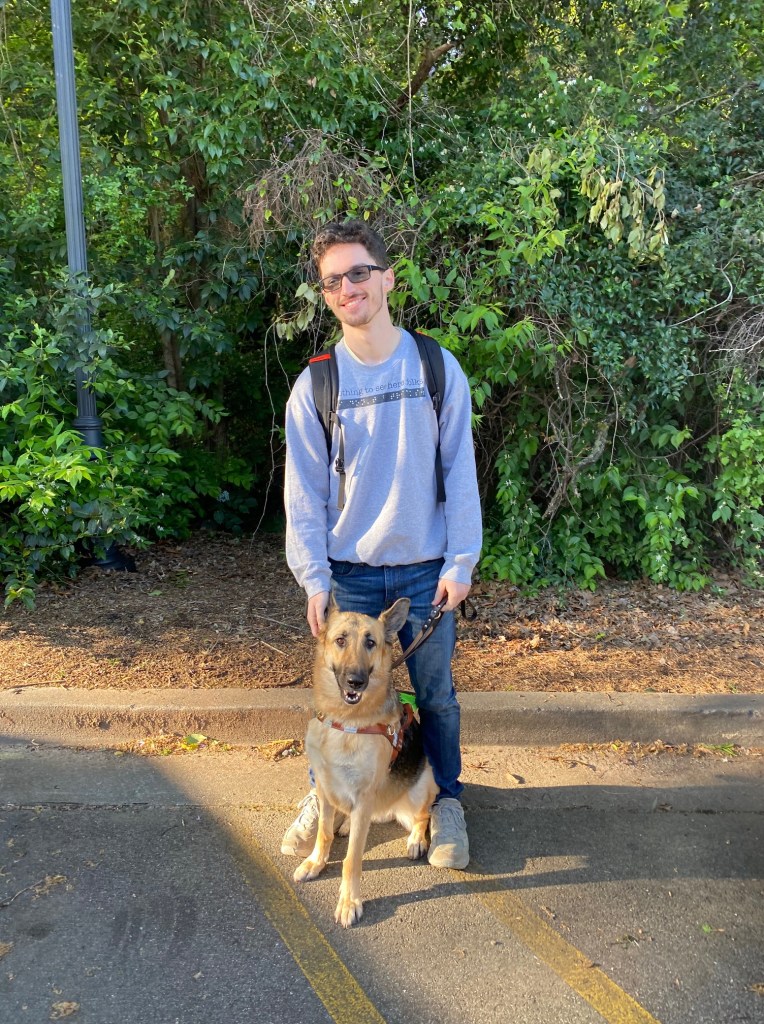 Kai with his guide dog.